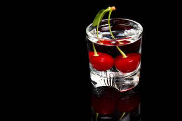 Sour cherry in a glass. Cherry drink