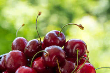 juicy handfull of strawberries on the background of nature
