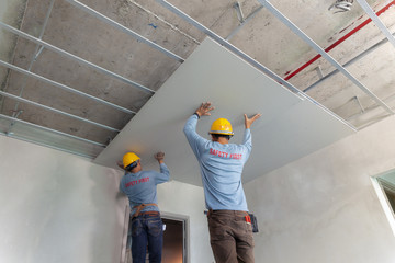 Two man  help for ceiling house construction
