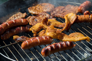 Unhealthy but tasty grilled sausages and meat