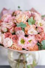 Floristry concept. Bouquet of beautiful flowers on gray table. Spring colors. the work of the florist at a flower shop.