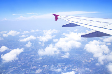 Aerial view from airplane window with sky clouds