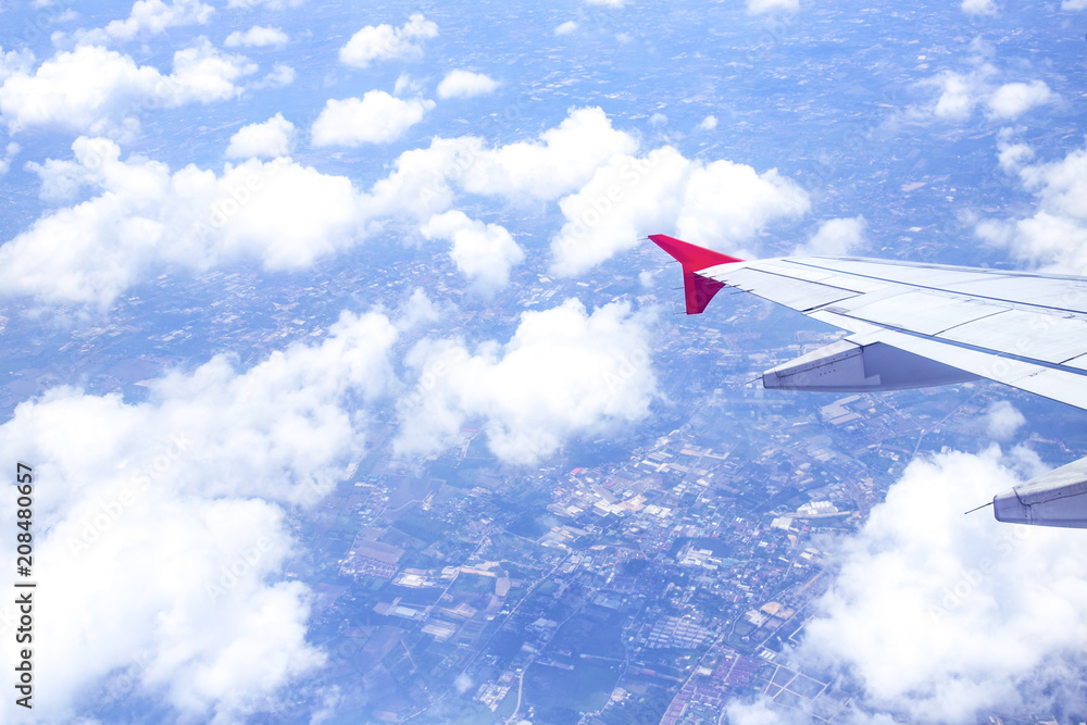 Wall mural aerial view from airplane window with sky clouds