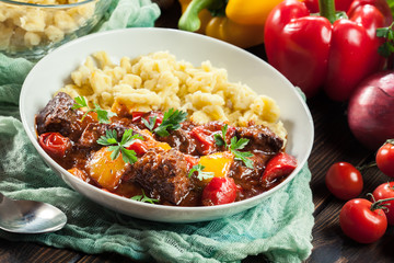 Hungarian beef goulash serwed with galuska noodles
