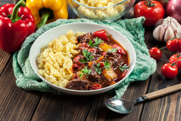 Hungarian beef goulash serwed with galuska noodles