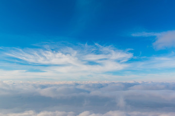 Bright sky blue background. Sky in daylight with beautiful white cloud.