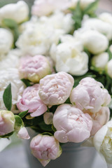 Beautiful bouquet of white and pink peonies . Floral composition, daylight. Wallpaper. Vertical photo