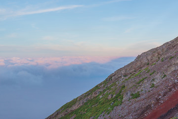 Shadow of Mt. fuji with cloudy sky view from top of Mt. fuji.