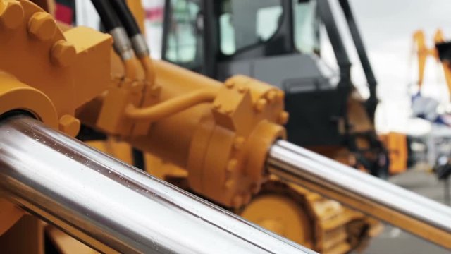 Hydraulic piston system for tractors, bulldozers, excavators. details of construction equipment