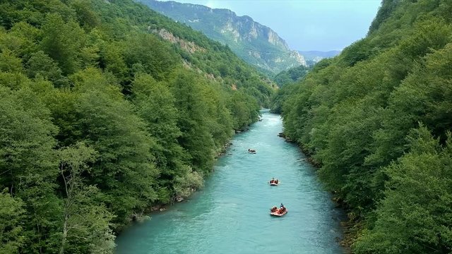Aerial Drone Video of Four Rafting Boats on Whitewater