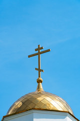 Orthodox cross on the dome of church