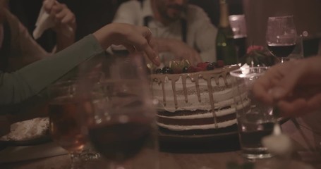 People eating dessert cake with fruit at countryside dinner party - Powered by Adobe