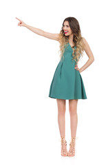 Fototapeta premium Elegant Woman In High Heels Is Standing, Touching Something And Laughing