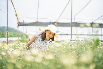 portrait of a beautiful woman in a field with flowers