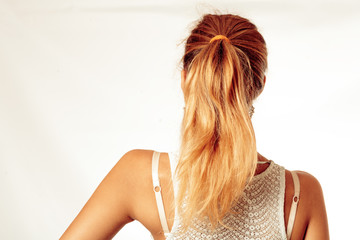 Portrait Of Beautiful Middle Age Blond Woman With Pony Tail Dyed Hair. Backside View