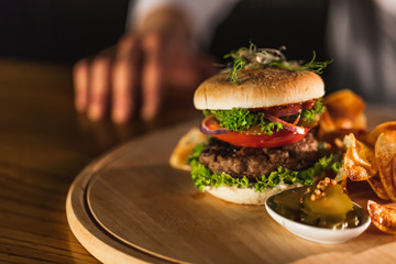 Chef making burger in the kitchen.