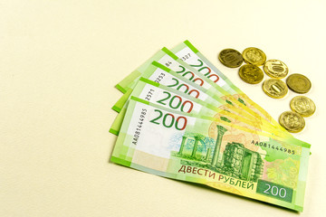 Russian cash. Banknotes in two hundred rubles. Several coins.