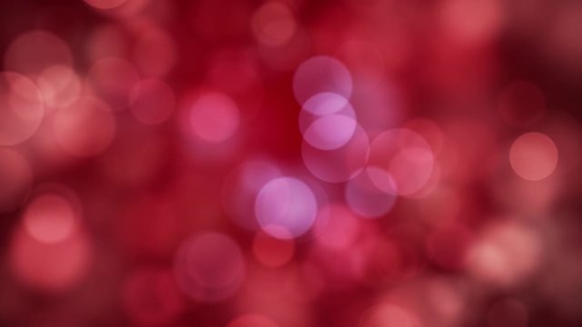 Moving red glitter lights, defocused light reflections loopable bokeh background