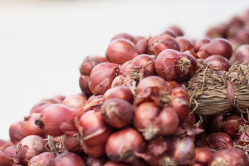 Red onions for sale in market.
