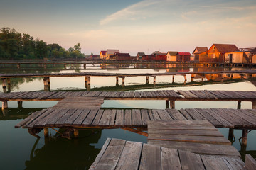 Fototapeta na wymiar Wooden cottages on the Bokod lake in Hungary
