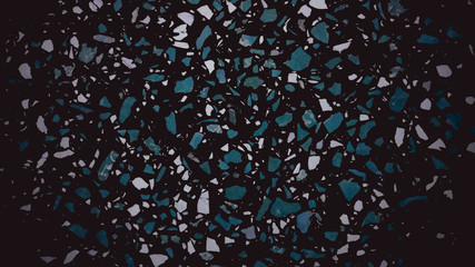 Dark artificial marble background. Green, blue and white flying particles
