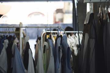 Fototapeta na wymiar Women clothing on hangers in a boutique store