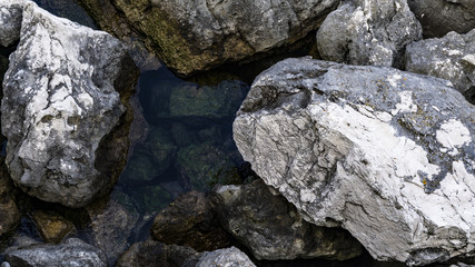 Clear and crystalline sea with rocks