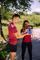 Fototapeta premium Young fitness couple outdoor exercise