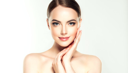     Beautiful Young Woman with Clean Fresh Skin look away .Girl beauty face care. Facial treatment...