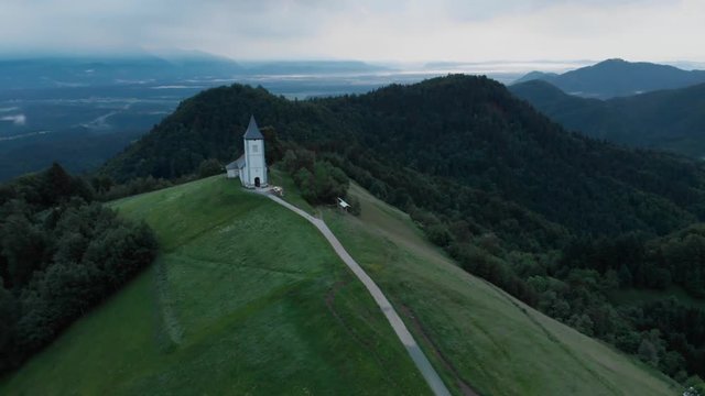 Aerial view over Lonely Chapel of  St. Primus and Felician, Jamnik, Slovenia