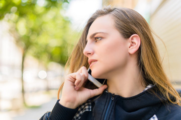 PORTRAIT OF A WOMAN TALKING ON THE CELL PHONE