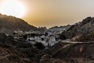 Fototapeta na wymiar Sunrise in summer on the old town of Muscat in Oman - 1