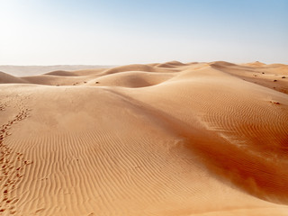 The dunes of the Wahiba Sands desert in Oman at sunset during a typical summer sand storm - 6