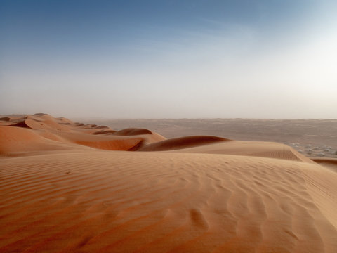 The dunes of the Wahiba Sands desert in Oman at sunset during a typical summer sand storm - 3