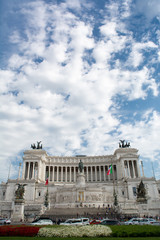 Vertical View of the Altar of the Fatherland on Blue Partially Cloudy Sky Background