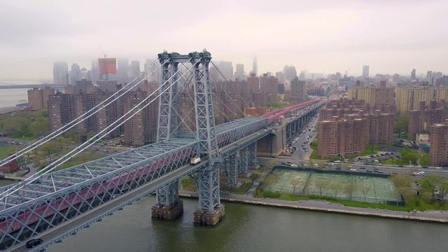 New York City skyline aerial of East River and Williamsburg Bridge drone shot.