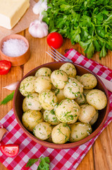 Boiled young potatoes with butter, dill and garlic