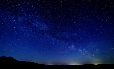 The milky way and the stars above the horizon.