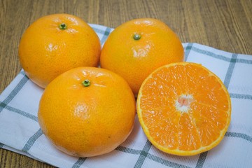 Ripe and Sweet Oranges on A Wooden Table