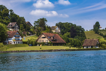 Fototapeta na wymiar Town Hertenstein on Lucerne lake
