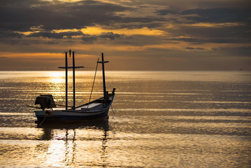 Fishing boat floating in the sea at morning sunshine time.Thailand.