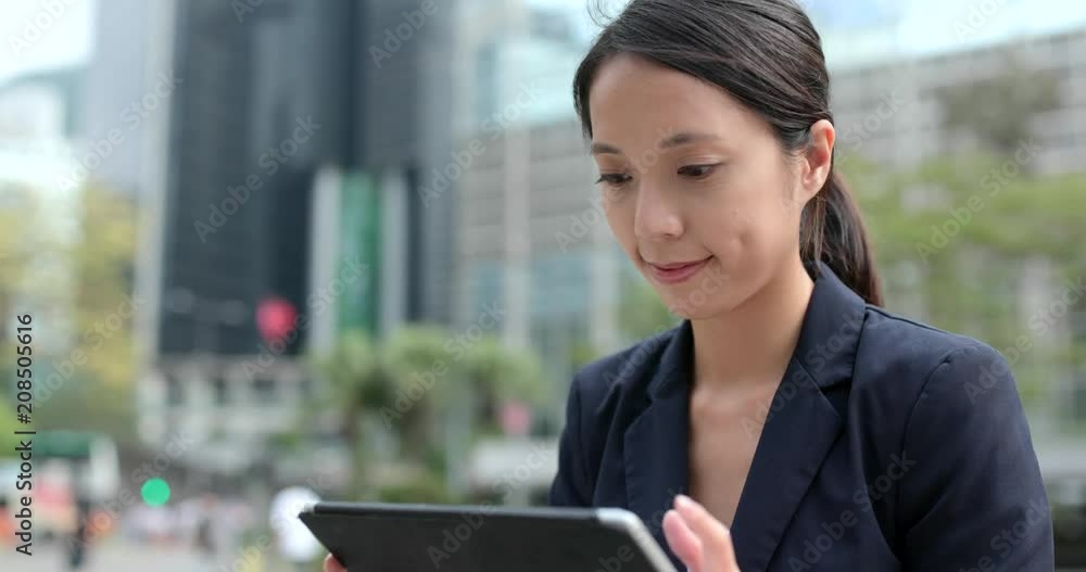 Wall mural Businesswoman work on tablet computer