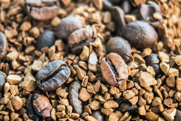 Roasted coffee beans and granulated coffee. background