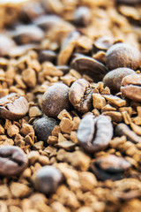 Roasted coffee beans and granulated coffee. background
