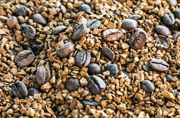 Roasted coffee beans and granulated coffee. background