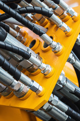 pipes and the hydraulic system of the tractor or excavator.Focus on the left side of the frame on...