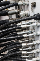 pipes and the hydraulic system of the tractor or excavator.Focus on the left side of the frame on the pipes