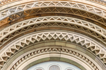 chopped stone arch over the entrance to the Catholic church