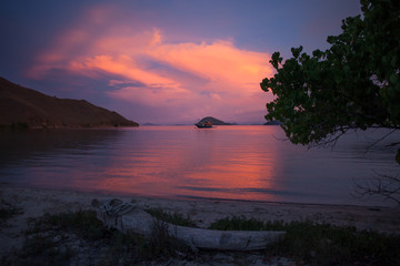 Fototapeta na wymiar Sunset colors over the ocean in the Komodo Islands