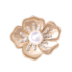 gold brooch flower with a pearl and diamonds isolated on white
